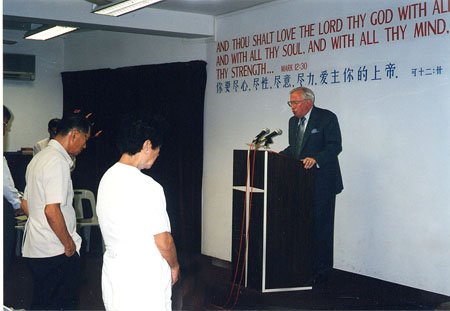 Ken preaching in Singapore
